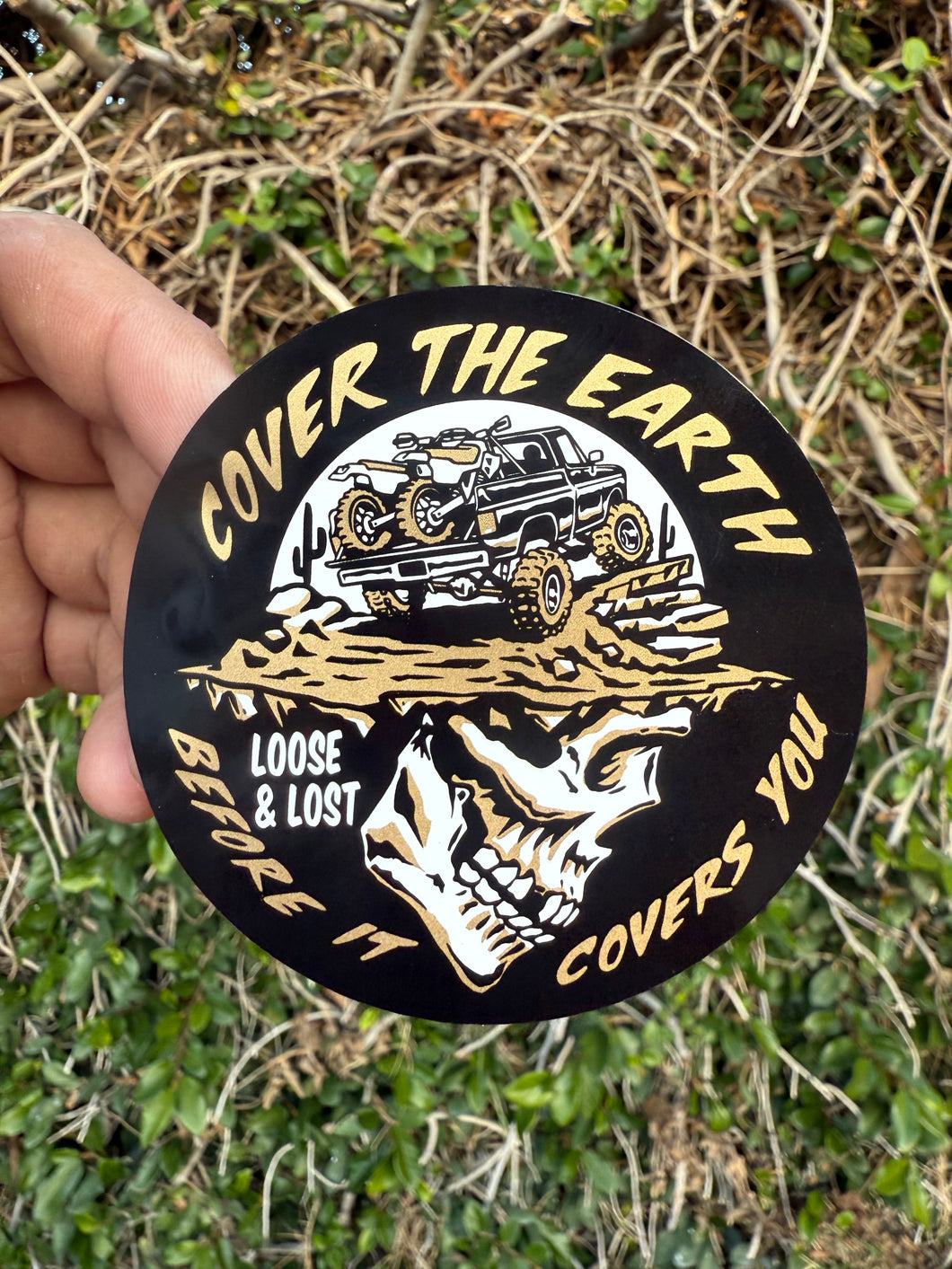 Cover the earth gold sticker