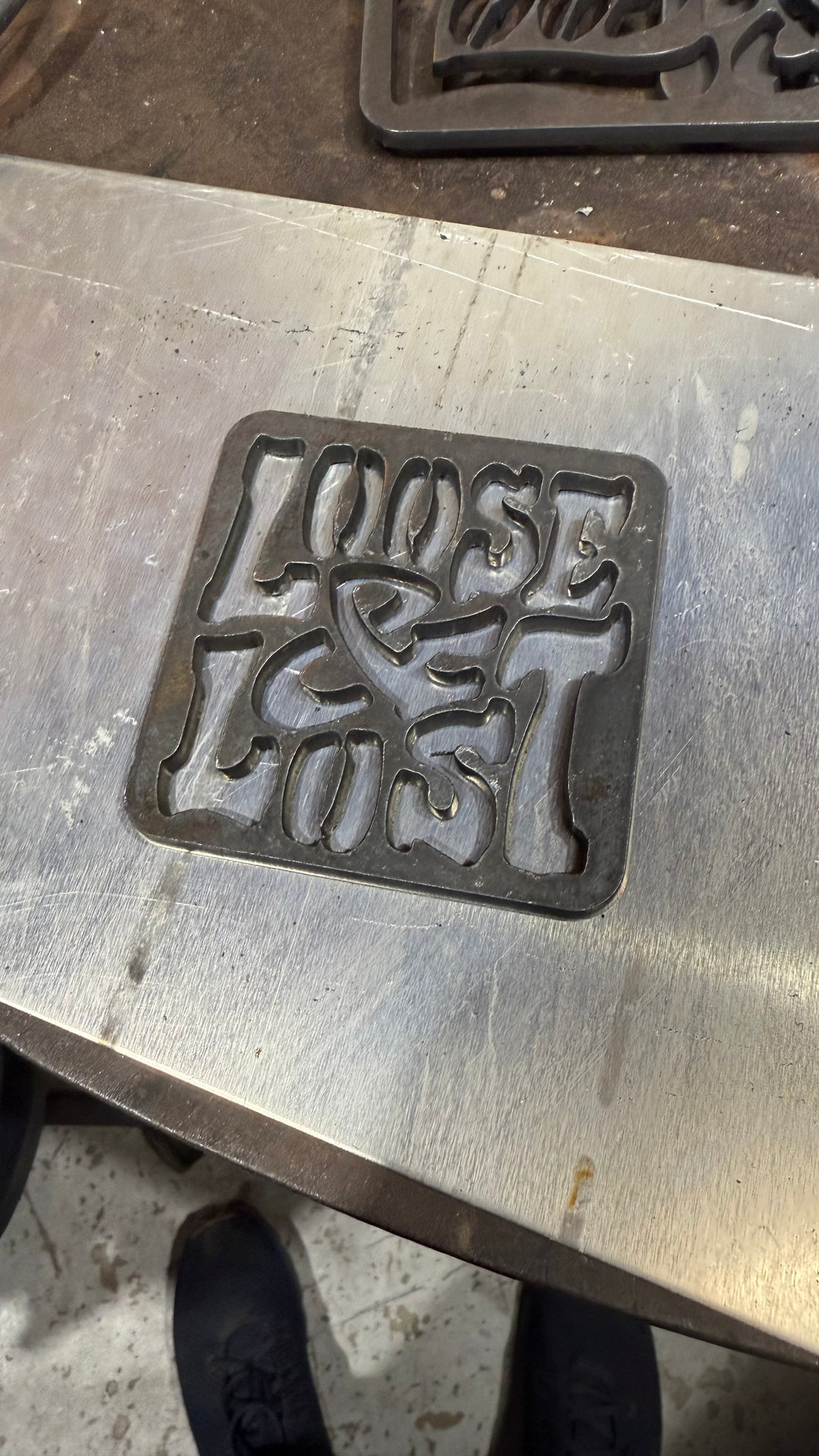 Square Metal Logo