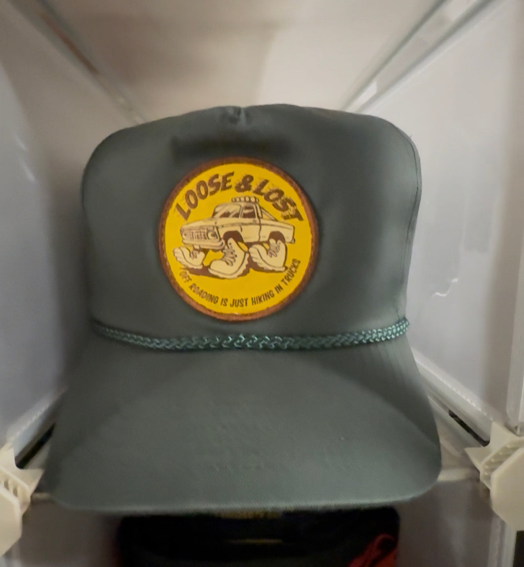 Hiking in trucks green rope golf hat